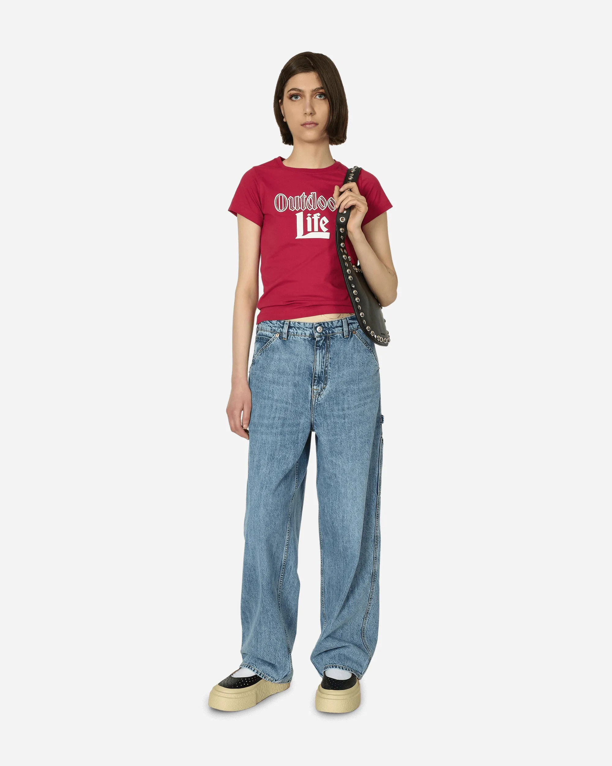 Pinkes T-Shirt mit angenähten Strasssteinen