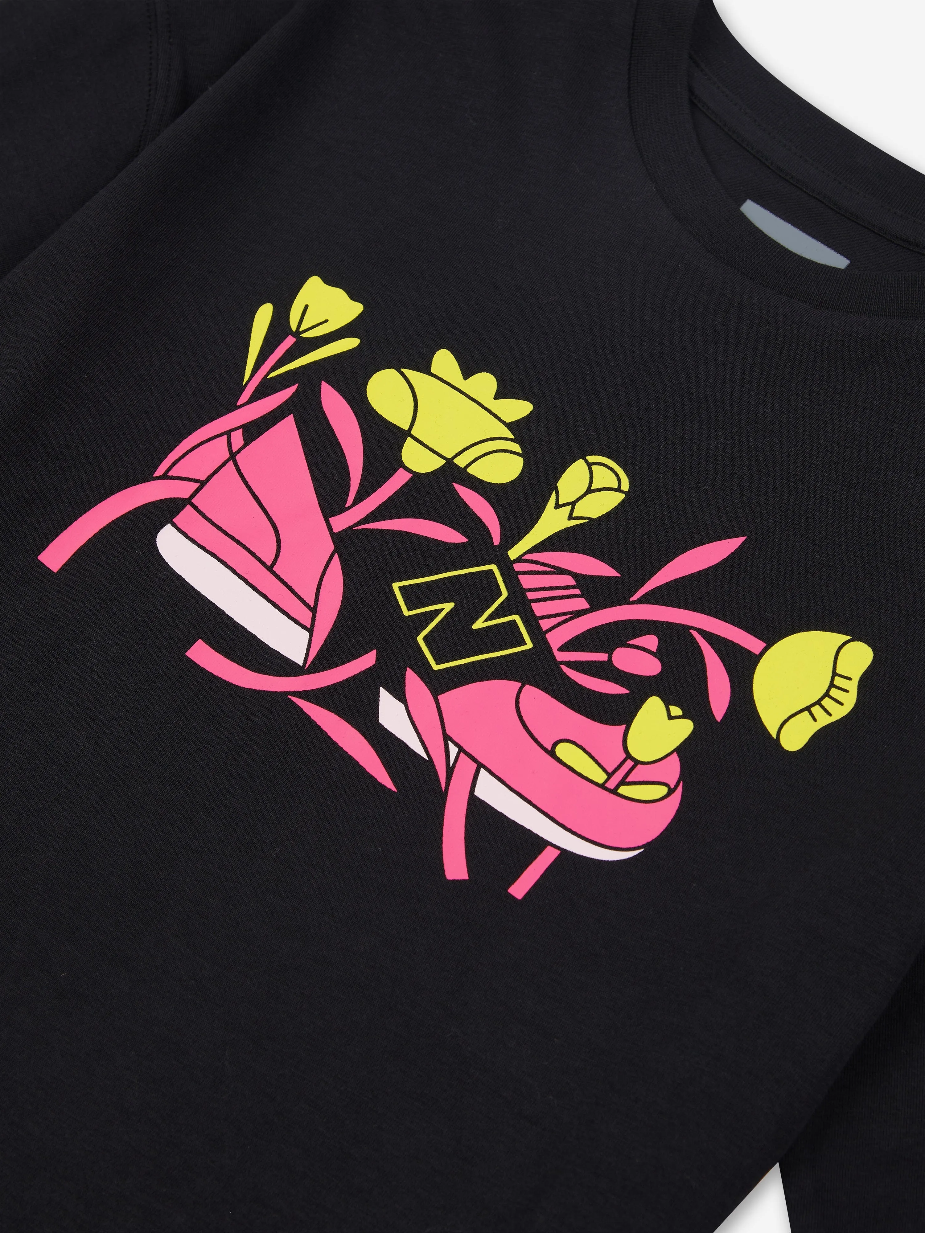 New Balance Mädchen Blumen-Schuh Grafik T-Shirt in Schwarz